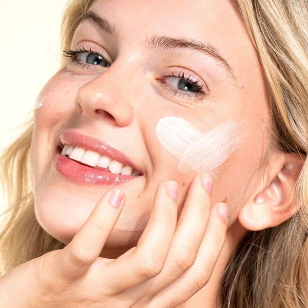 Applying Pacifica Wake Up Beautiful night cream for overnight absorption