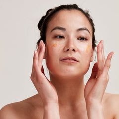 PAI SKINCARE Rosehip BioRegenerate oil on hand for nourishing daily glow.