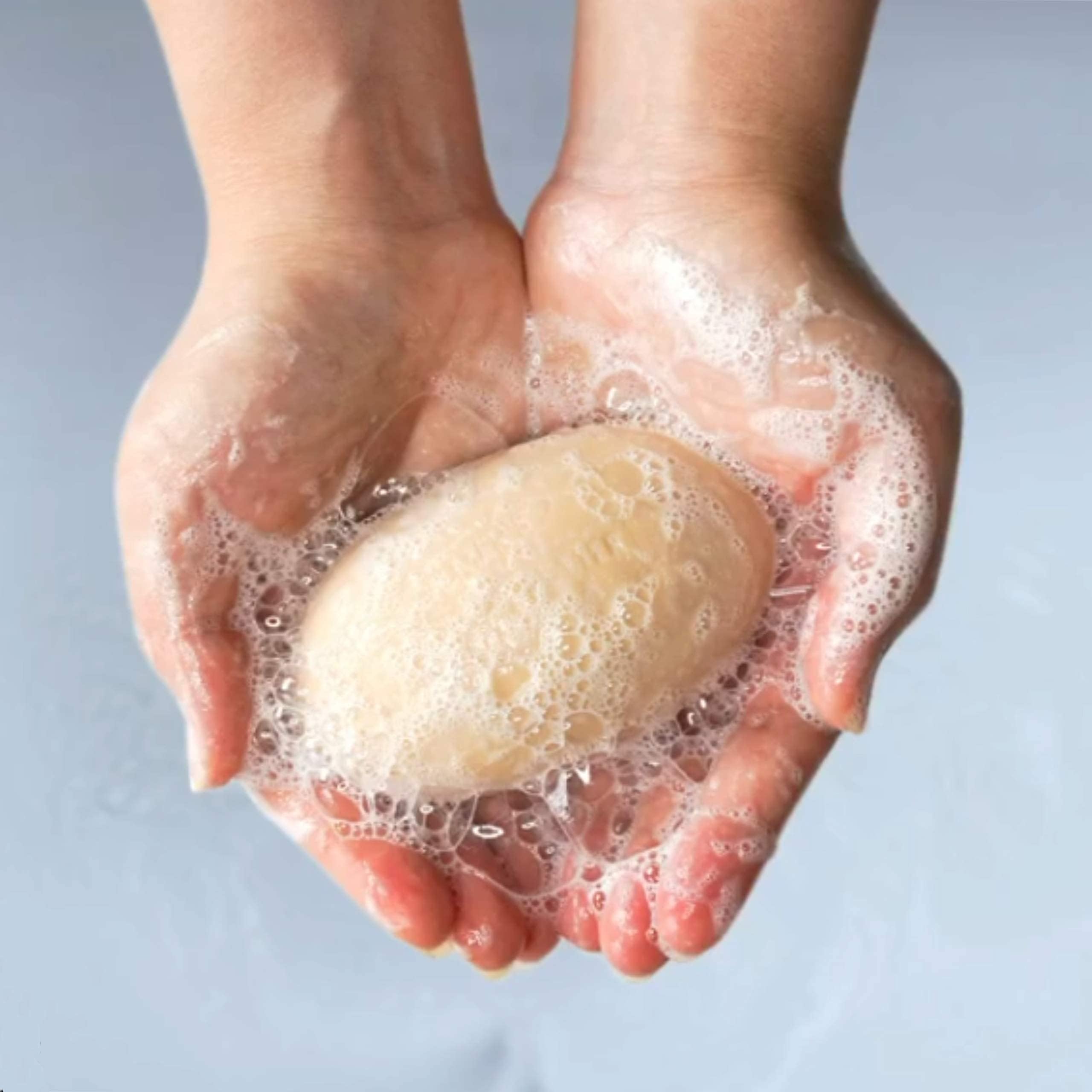 Palmer's Cocoa Butter Formula soap softening dry skin in shower.