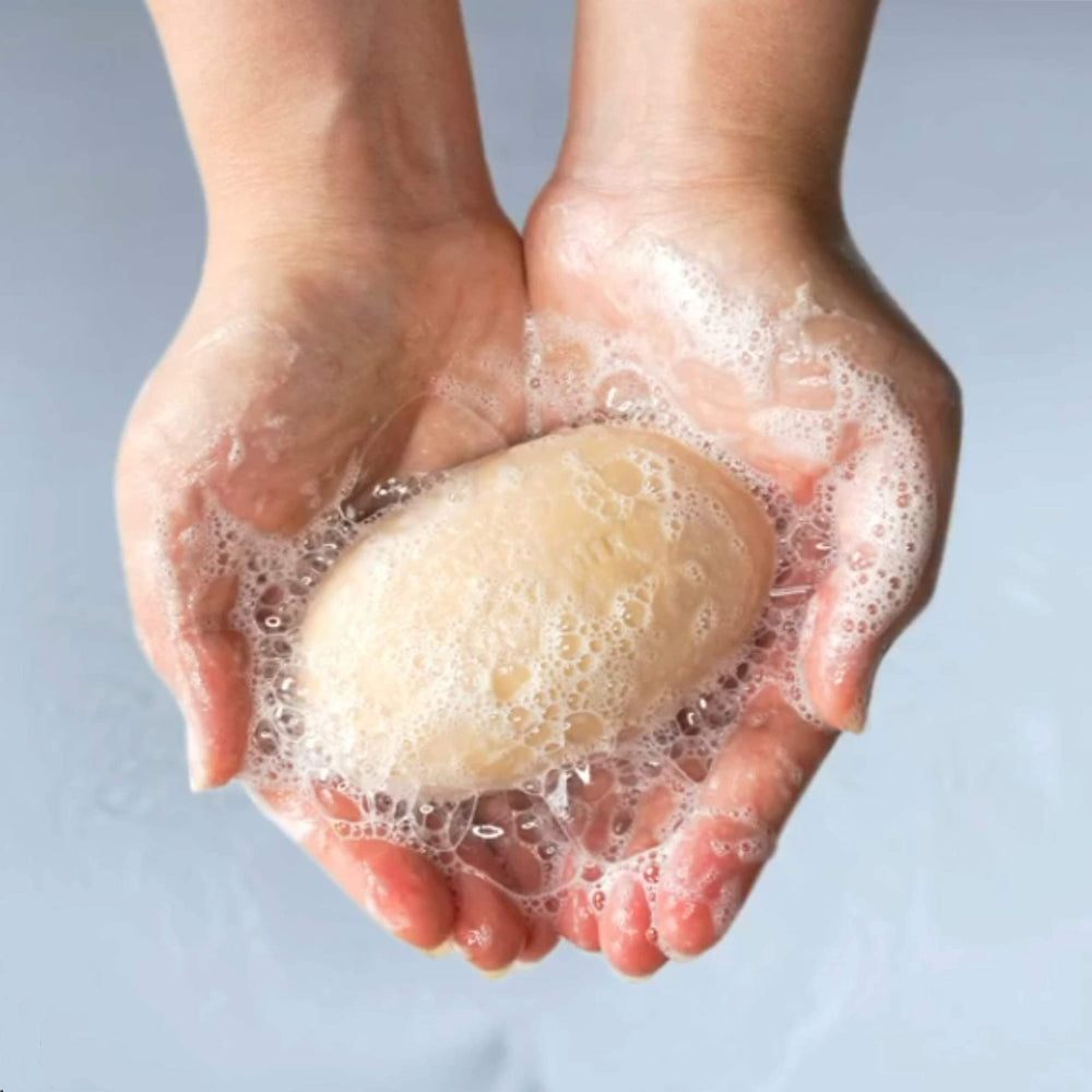 Palmer's Cocoa Butter Formula soap softening dry skin in shower.