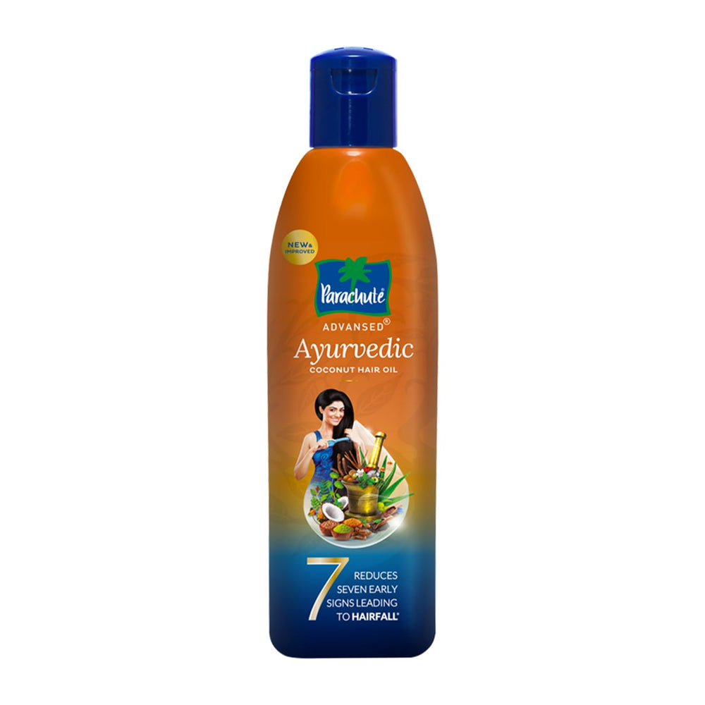 Parachute Advansed coconut hair oil bottle pouring nourishes the scalp