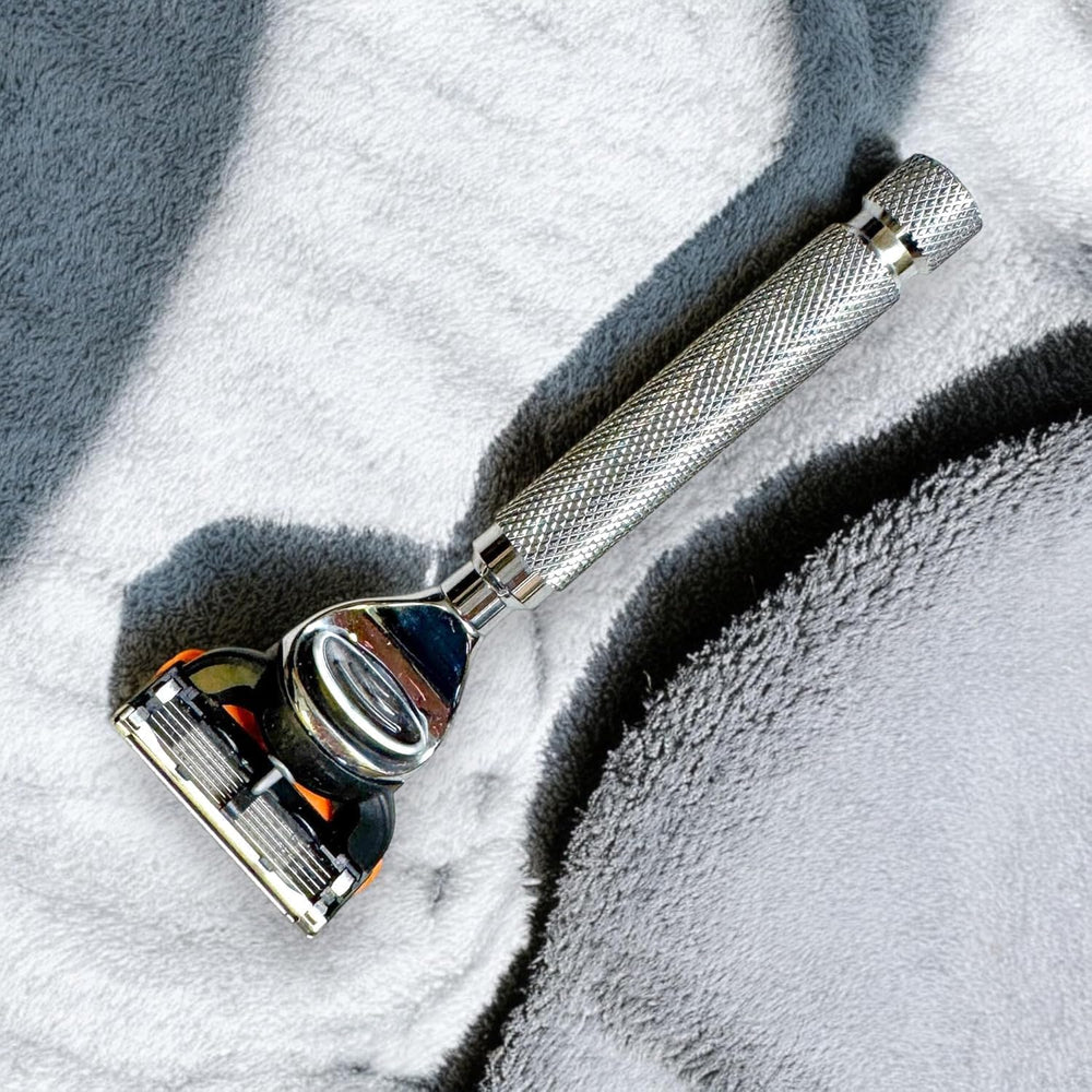 Parker Safety Razor textured-grip shot showing slip-free control on wet hands.
