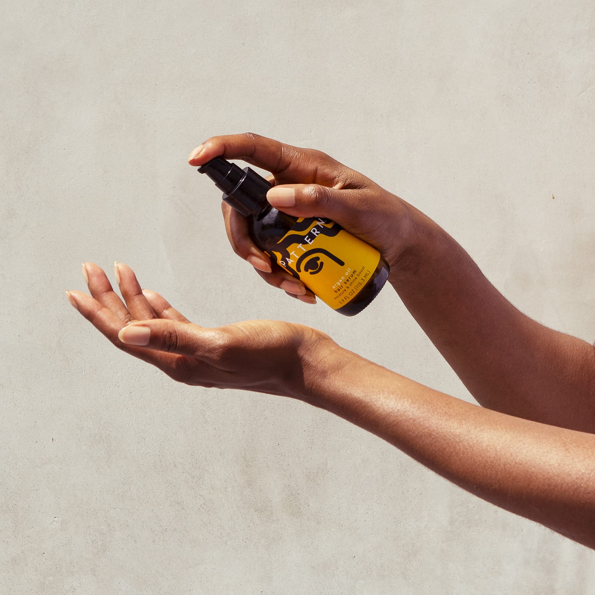 PATTERN Argan Oil Hair Serum on wet hair smooths curl cuticles.