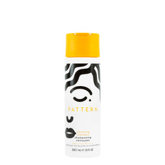PATTERN Beauty cleansing shampoo bottle label promotes clarifying cleanse for curly hair