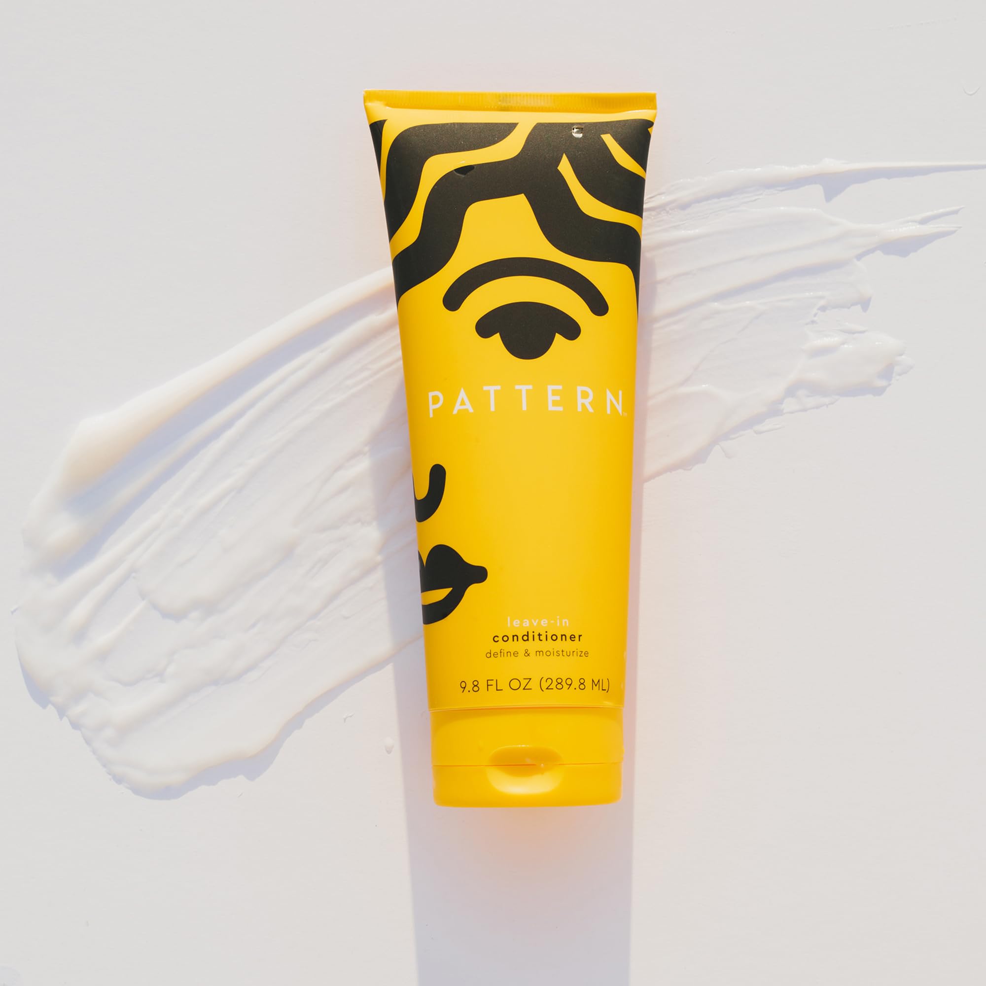 Self-care routine featuring PATTERN Beauty Leave-In Conditioner for healthy curls.