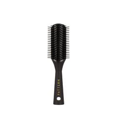 PATTERN Beauty Mini Shower Brush bristles closeup aiding gentle detangling of curls.