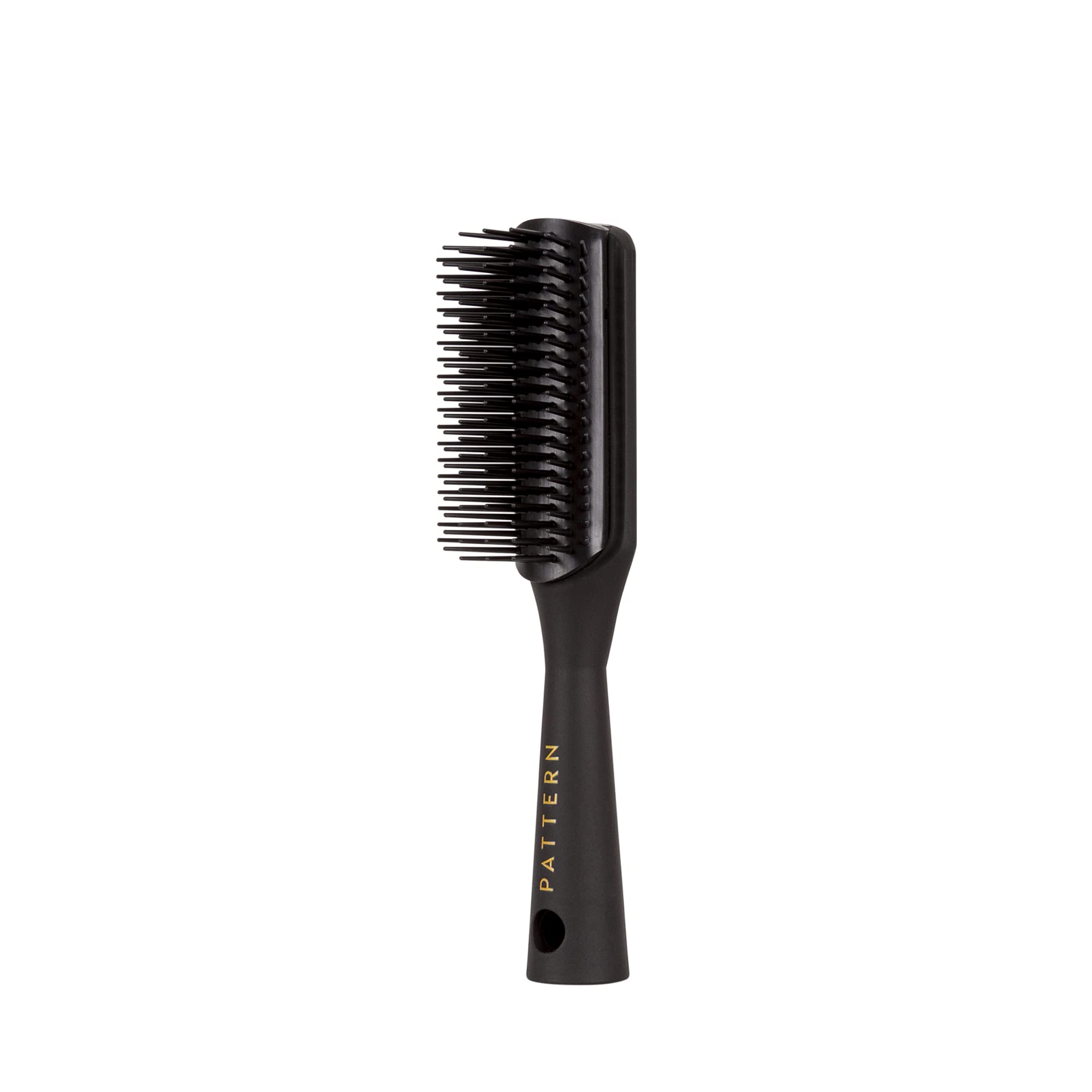 PATTERN Beauty Mini Shower Brush tapered handle for comfortable grip during styling.