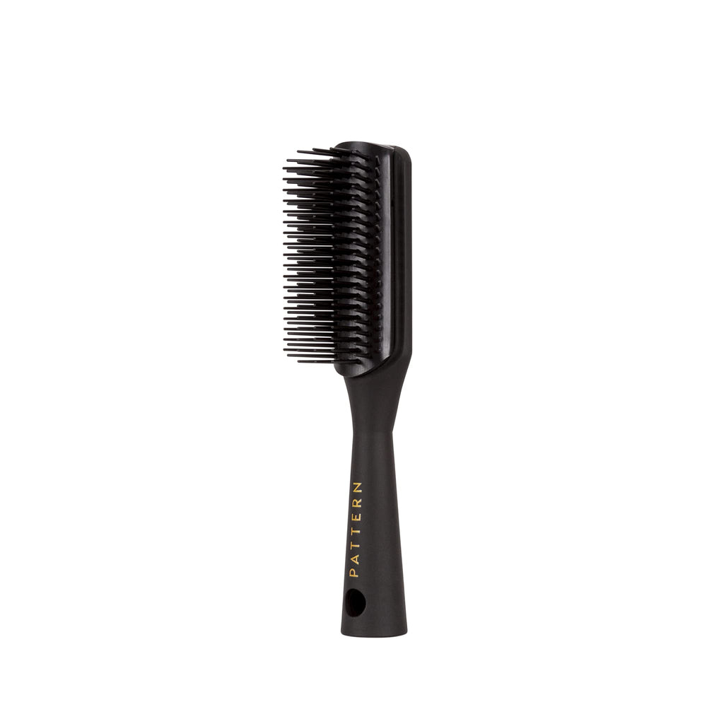 PATTERN Beauty Mini Shower Brush tapered handle for comfortable grip during styling.