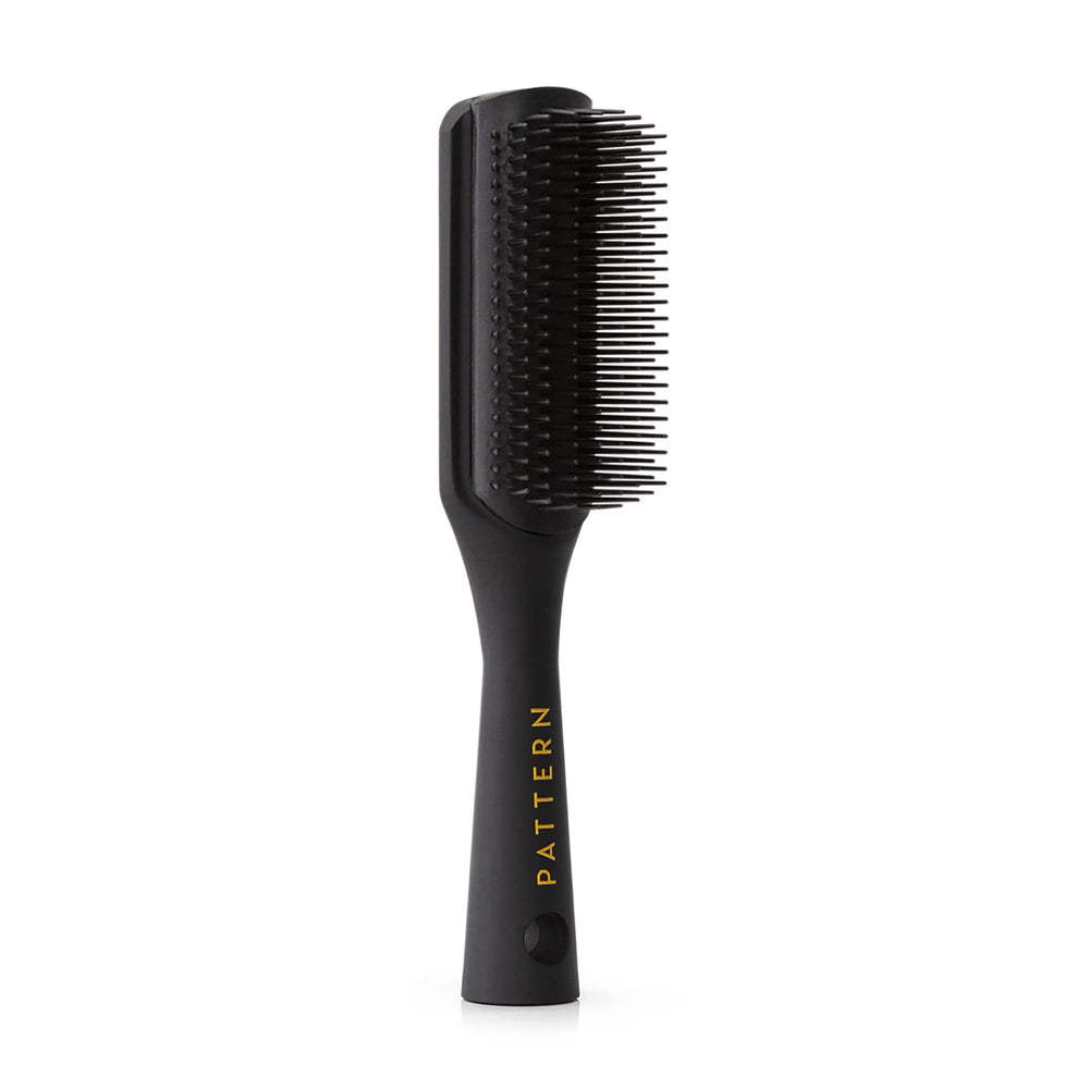 PATTERN Beauty Shower Brush bristles closeup demonstrates detangling curls and coils with ease.