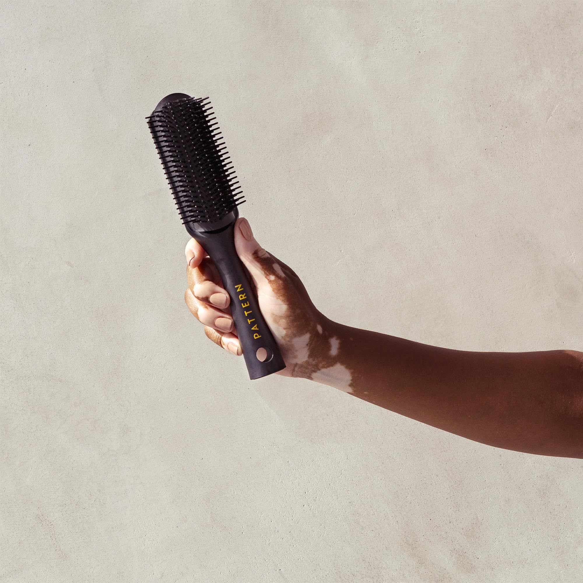 PATTERN Beauty Shower Brush durable materials convey premium quality for daily use.