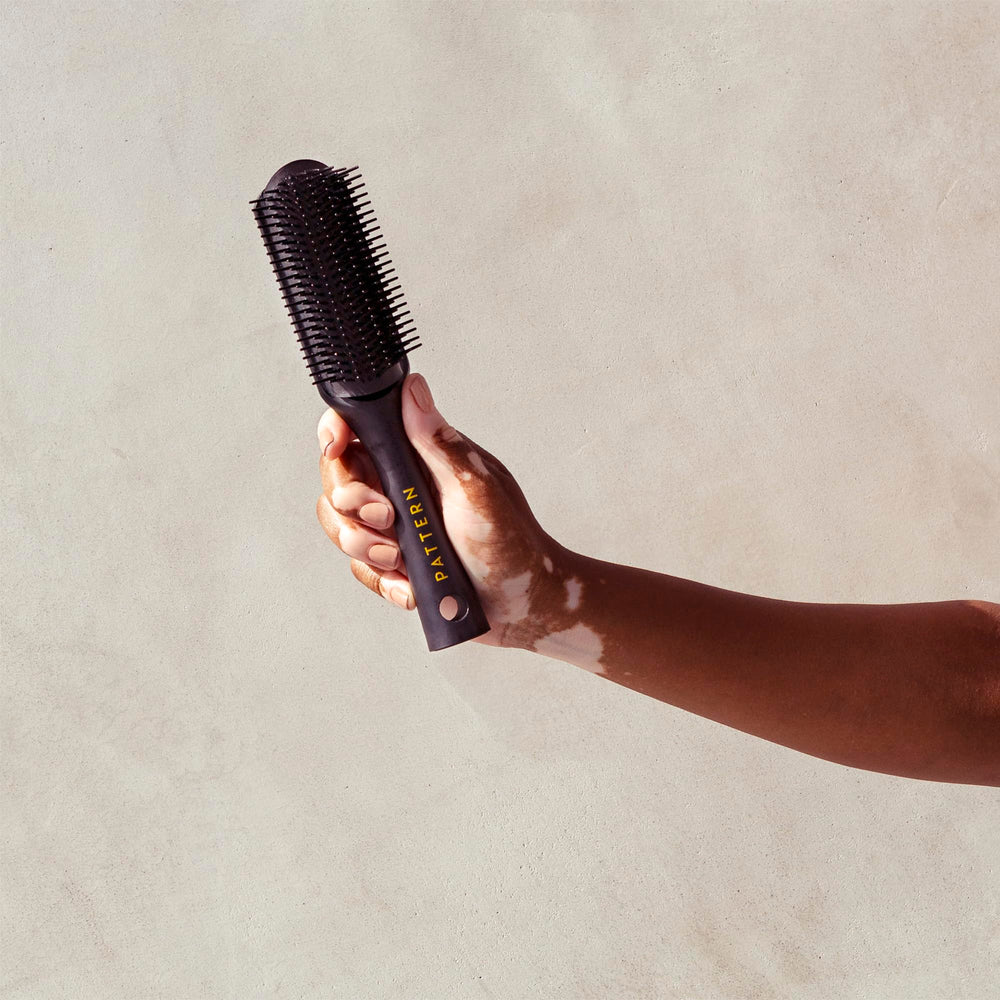 PATTERN Beauty Shower Brush durable materials convey premium quality for daily use.