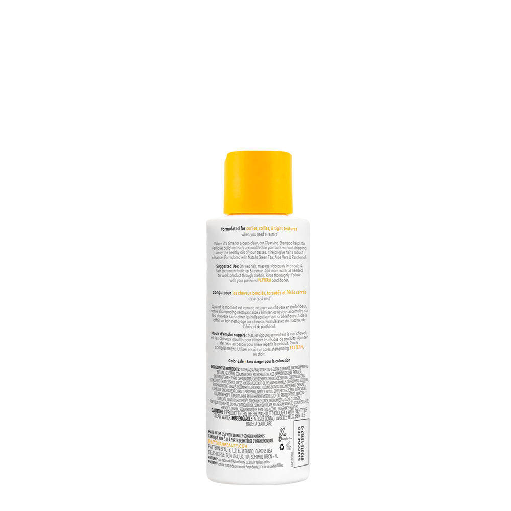 PATTERN Mini Cleansing Shampoo curls closeup demonstrates gentle residue removal for frizz-free styling.