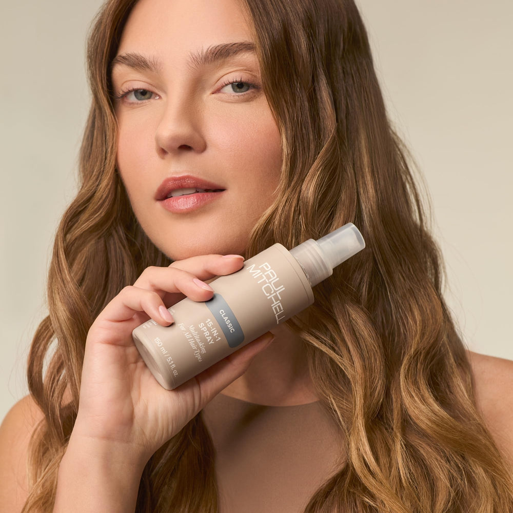 Paul Mitchell 15-In-1 Spray thermal protection in use during styling.