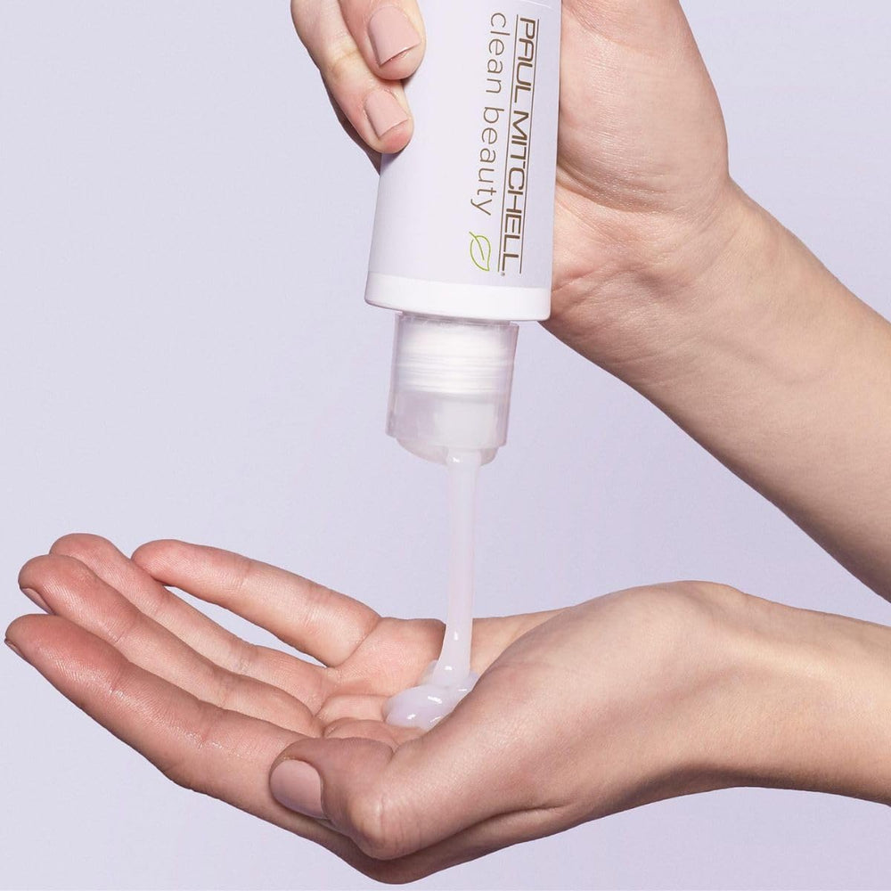 Paul Mitchell Clean Beauty Repair Leave-In Treatment pump close-up emphasizes easy to apply formula for brittle strands