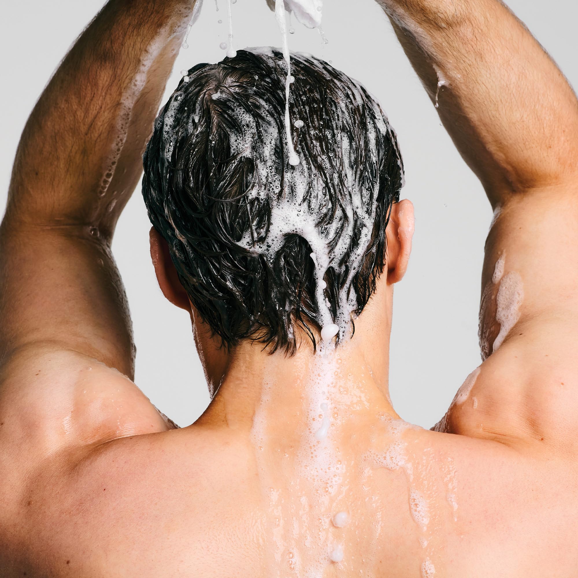 Paul Mitchell Clear Essential Shampoo on bathroom sink—easy daily-use routine for sensitive scalps.