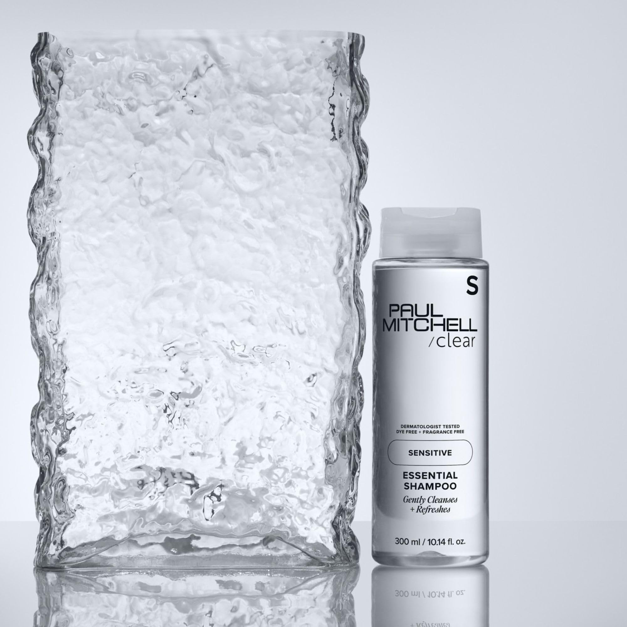 Paul Mitchell Clear Essential Shampoo label close-up—environmentally conscious packaging details.