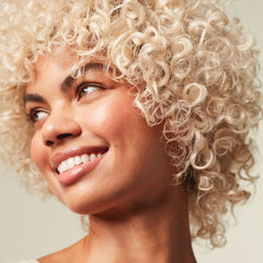 Paul Mitchell Forever Blonde shampoo lather demonstrates sulfate-free cleansing for lightened hair.