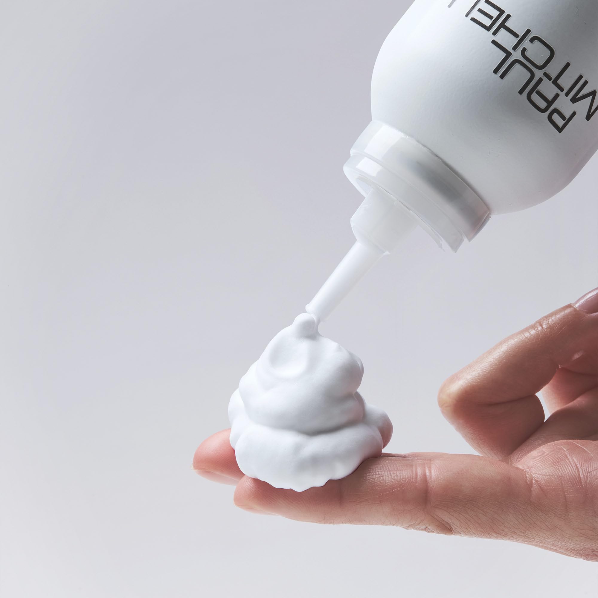 Paul Mitchell Sculpting Foam with coconut fragrance enhances the styling experience.