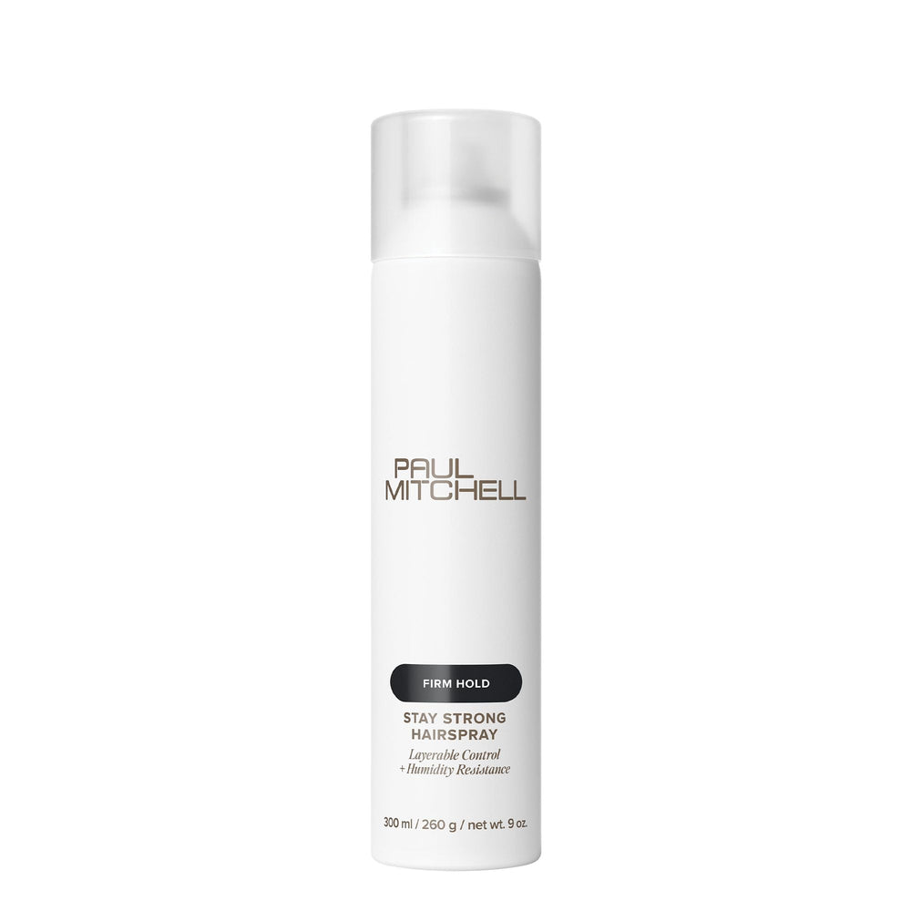 Paul Mitchell Stay Strong Hairspray bottle demonstrates a fine mist for layered hold.