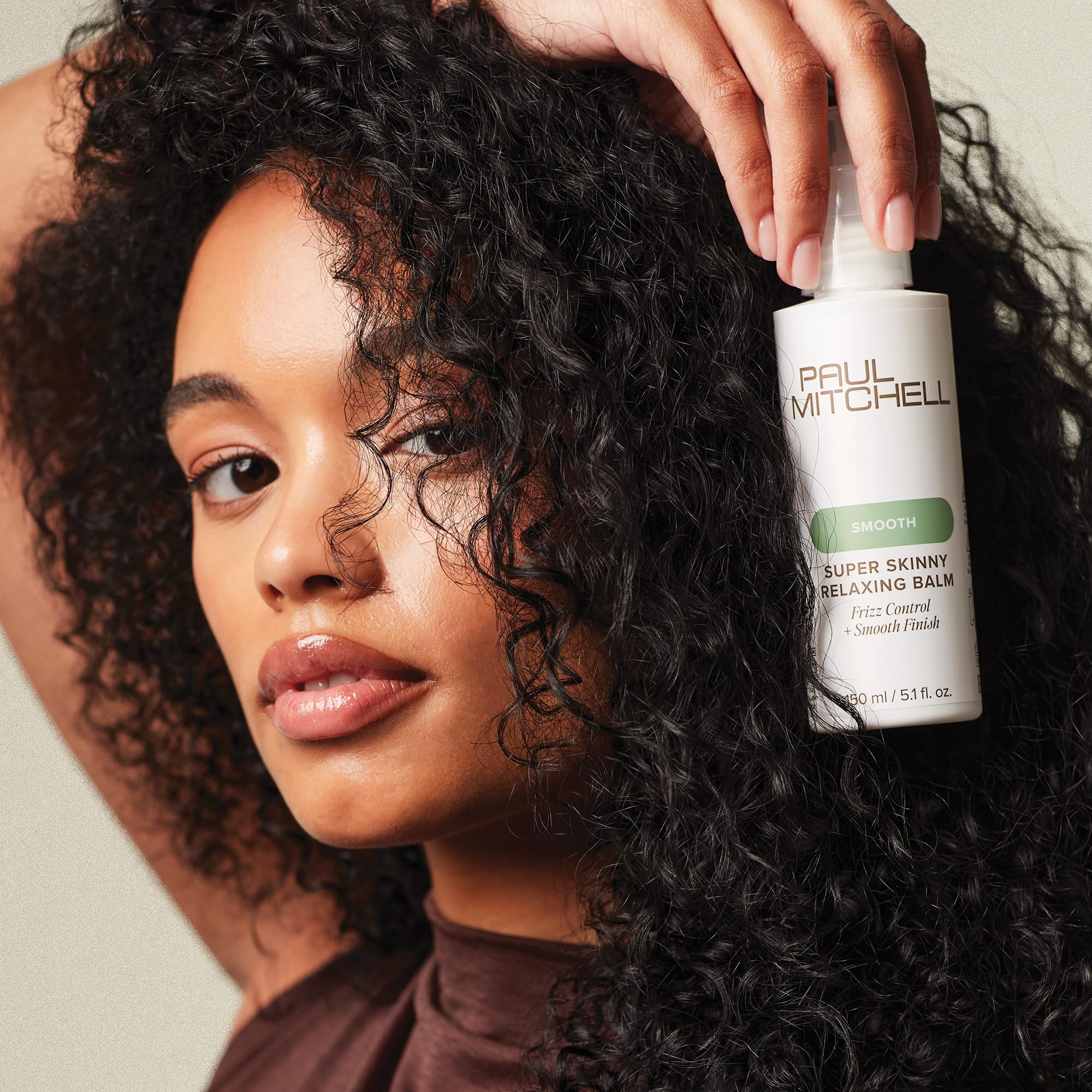 Hair being styled with the balm demonstrates shine and manageability.