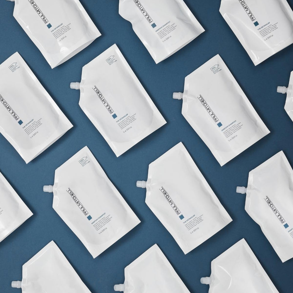 Paul Mitchell The Detangler refill pouch emphasizes waste-reducing packaging convenience.