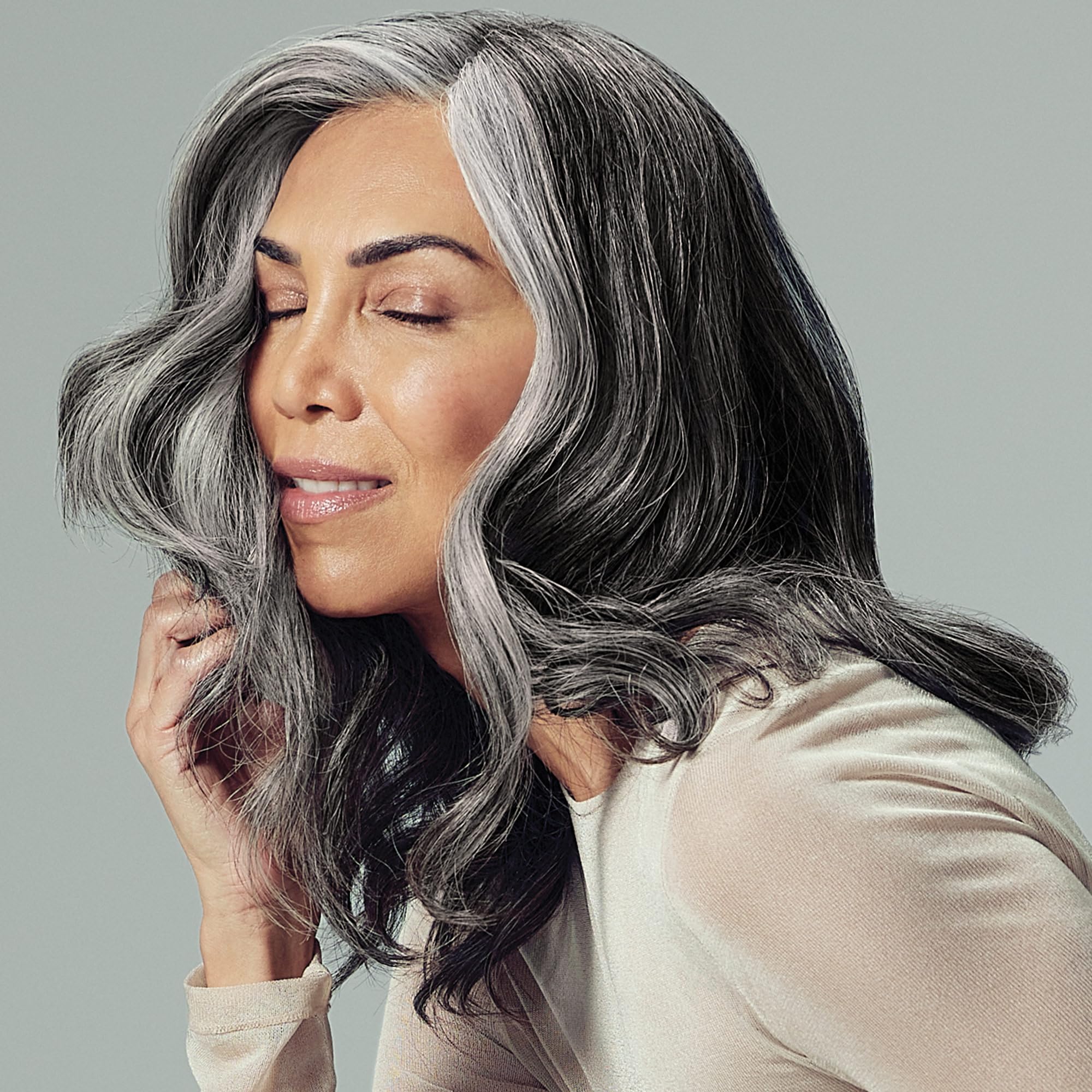 Paul Mitchell Thicken Up finish close-up shows soft shine and movement.