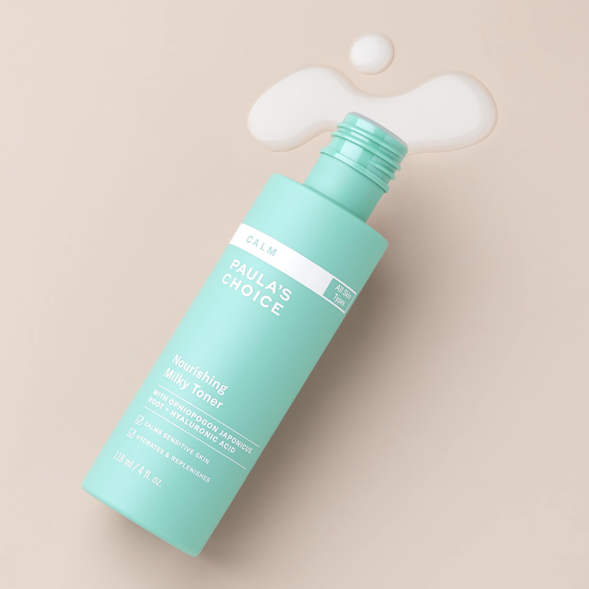 Paula's Choice Calm Milky Toner in hand for soothing redness and gentle refresh.