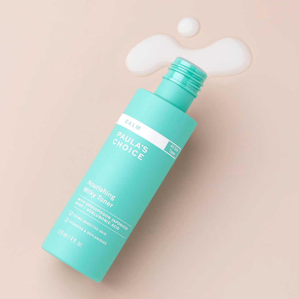Paula's Choice Calm Milky Toner in hand for soothing redness and gentle refresh.