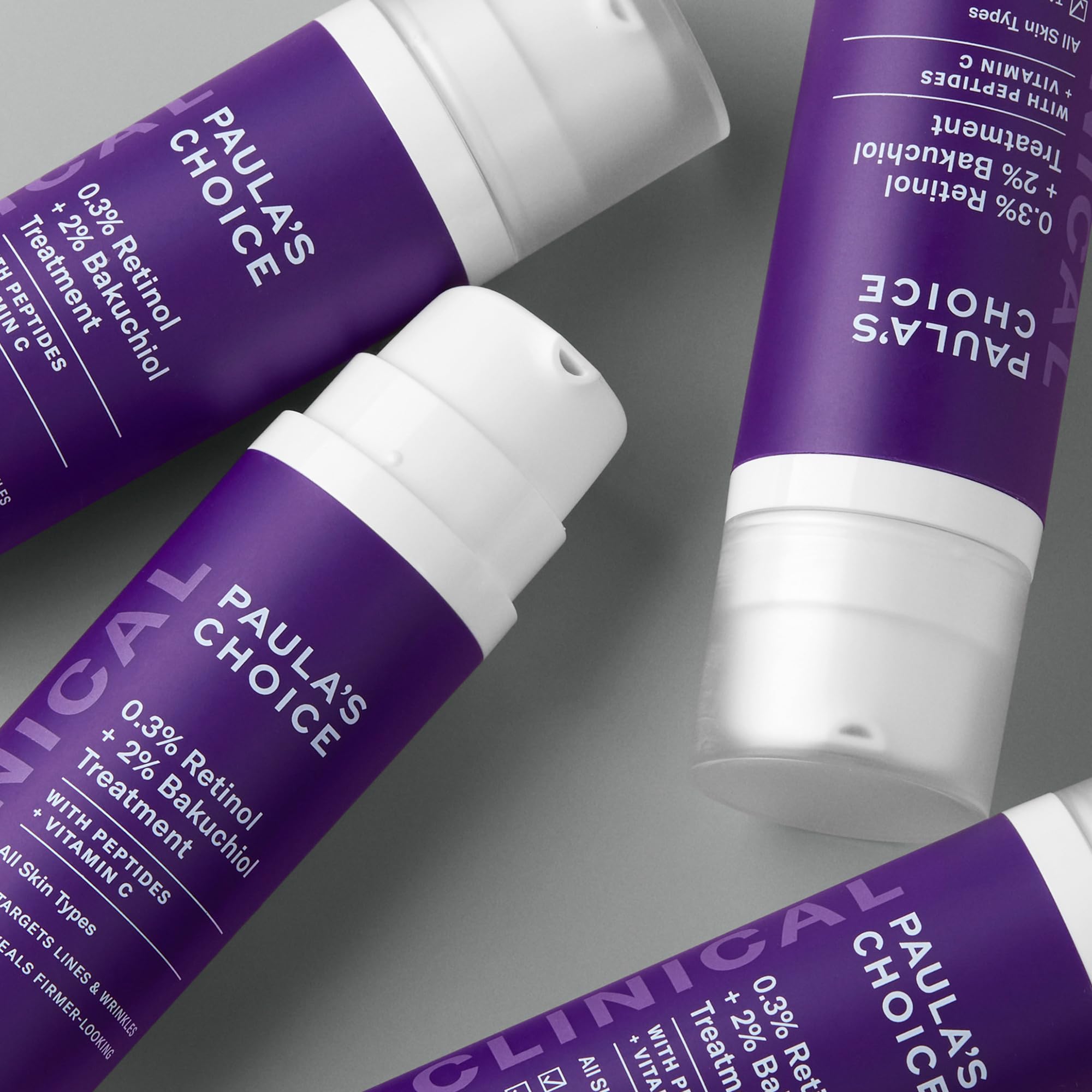 Paula's Choice Clinical serum ingredients icons highlight retinol, bakuchiol, and peptides
