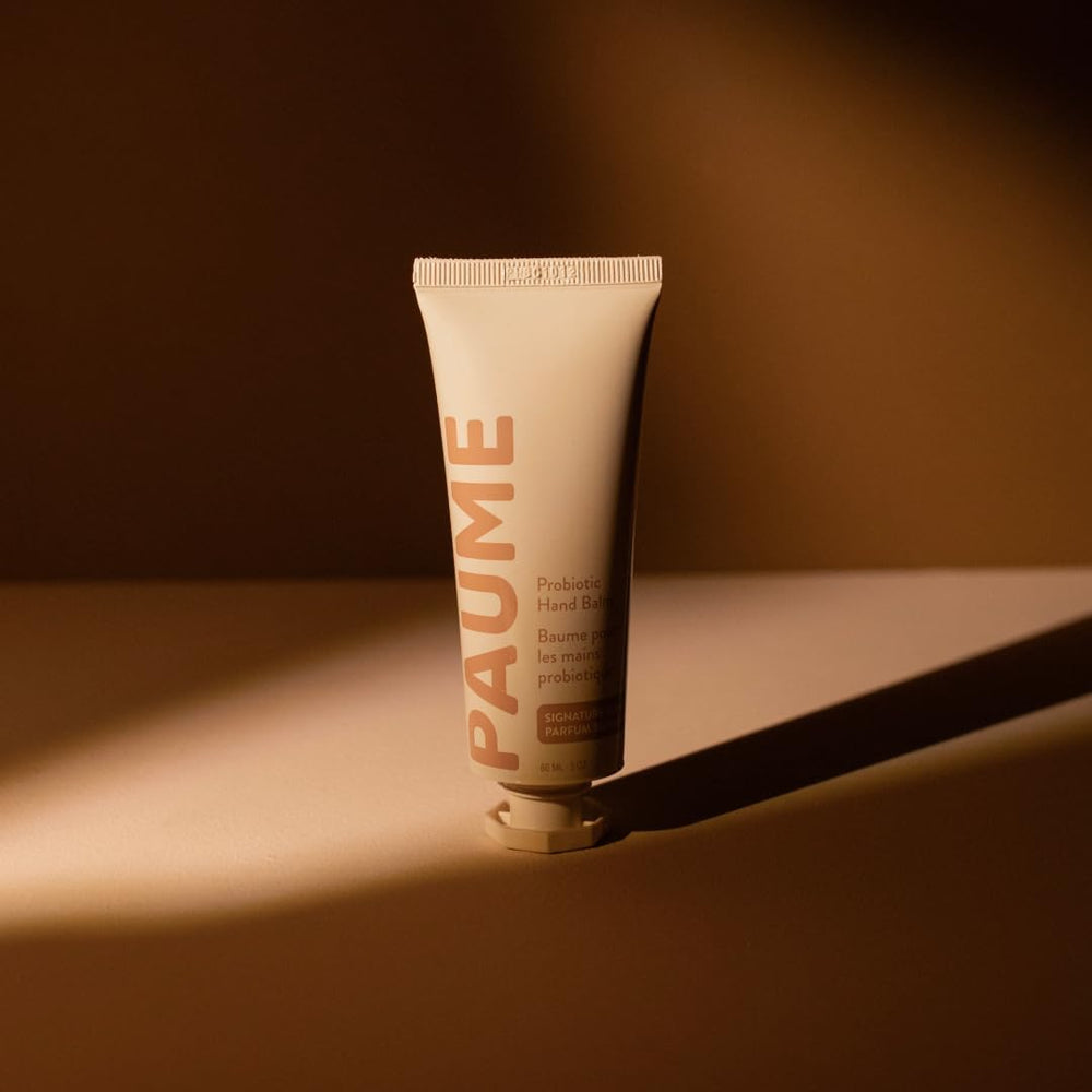 PAUME probiotic hand balm aging skin closeup suggests soothing, revived look.