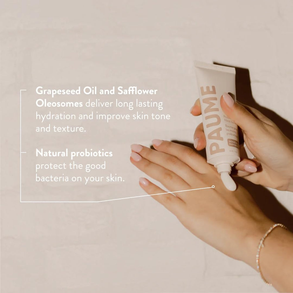 PAUME probiotic hand balm signature scent closeup conveys citrus and herbal notes.