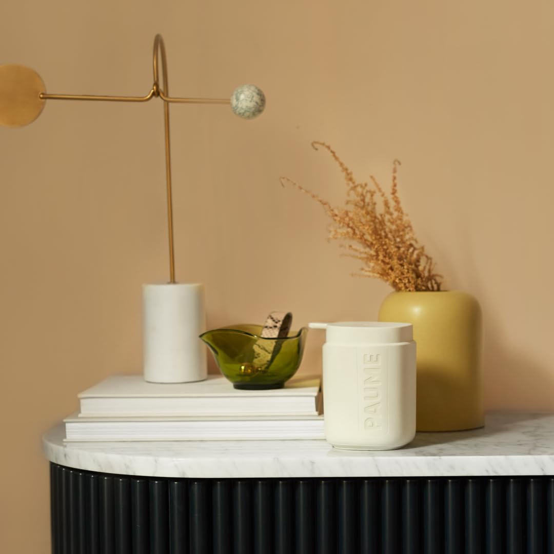 PAUME Signature Pump bathroom decor blends with towel cabinets and modern fixtures
