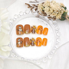 PBPCGBW gold glitter acrylic nails shining in a chic manicure shot.
