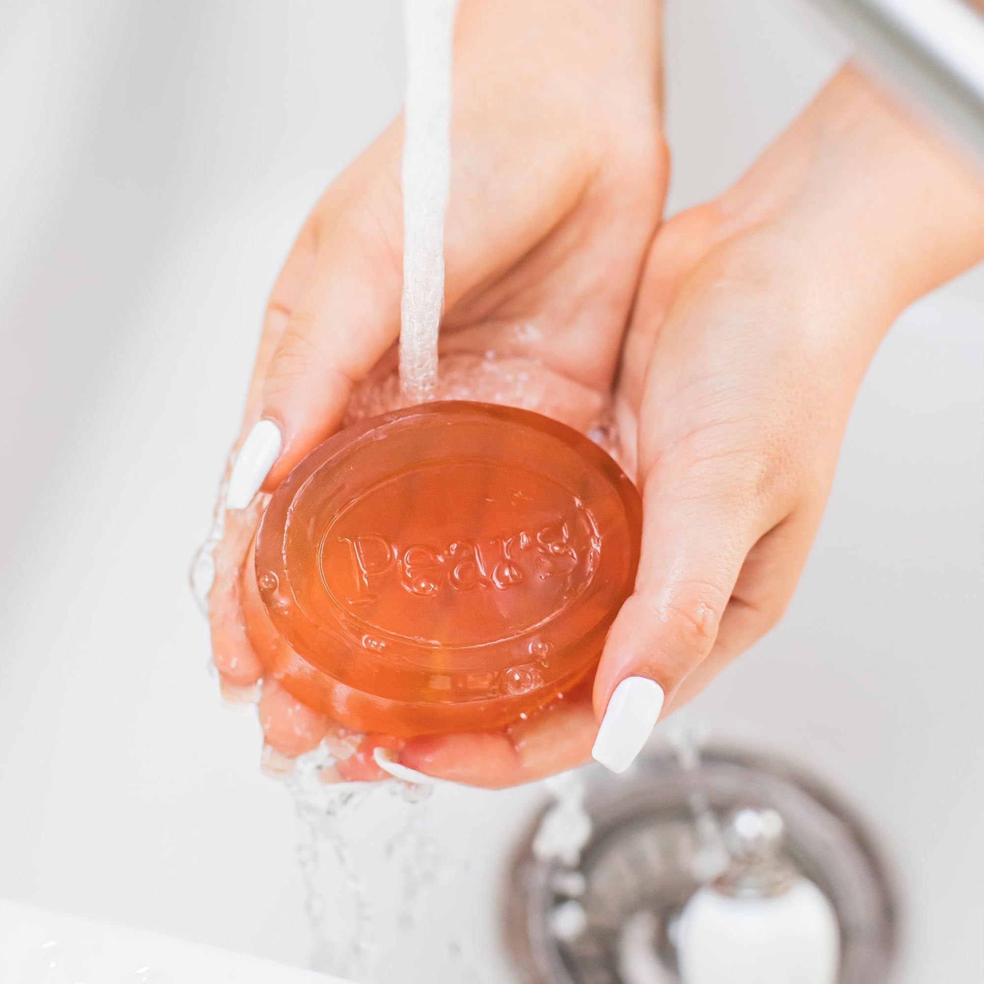 Pears soap hand-body-face usage image showing versatile daily cleanse.
