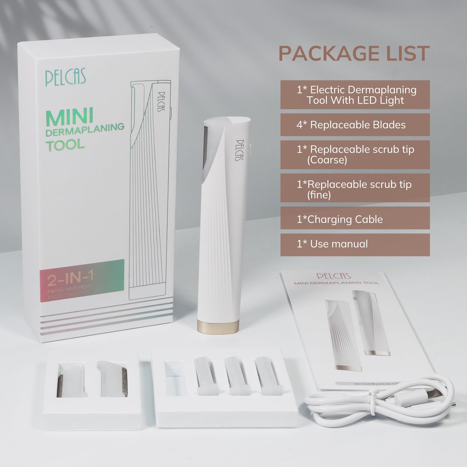Pelcas off-white device beside manual showcasing compact styling.