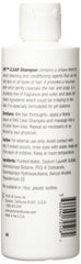 Person and Covey DHS Clear Shampoo bottle closeup label highlights easy daily use.