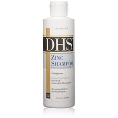Person and Covey DHS Zinc Shampoo bottle provides refreshing cleanse and long-lasting scalp nourishment.