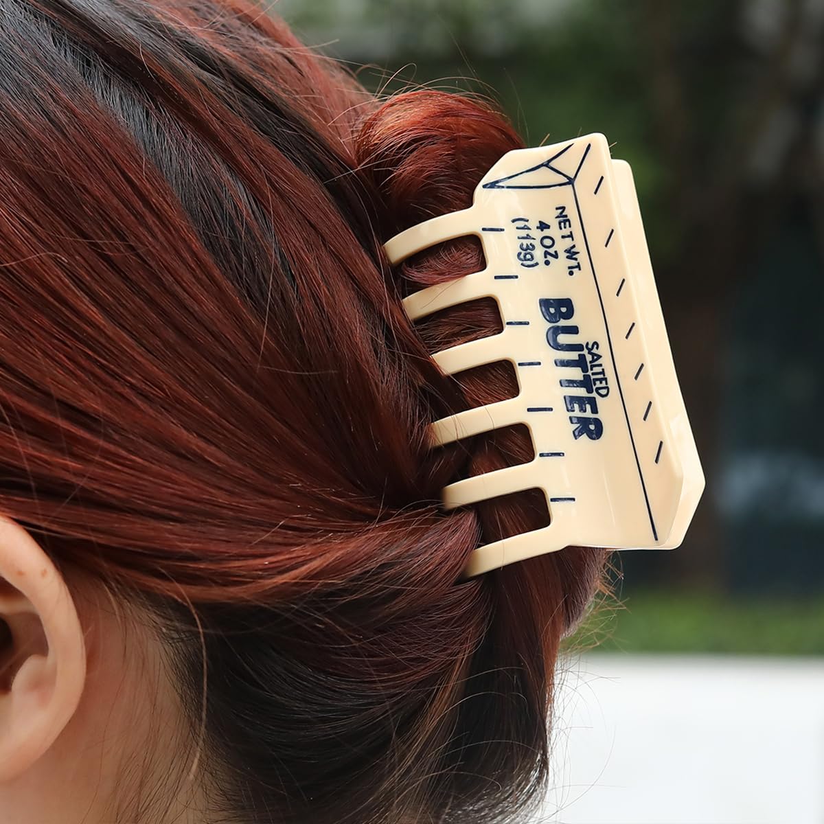 PERSONFUN butter clip shows wide opening and secure grip in use.