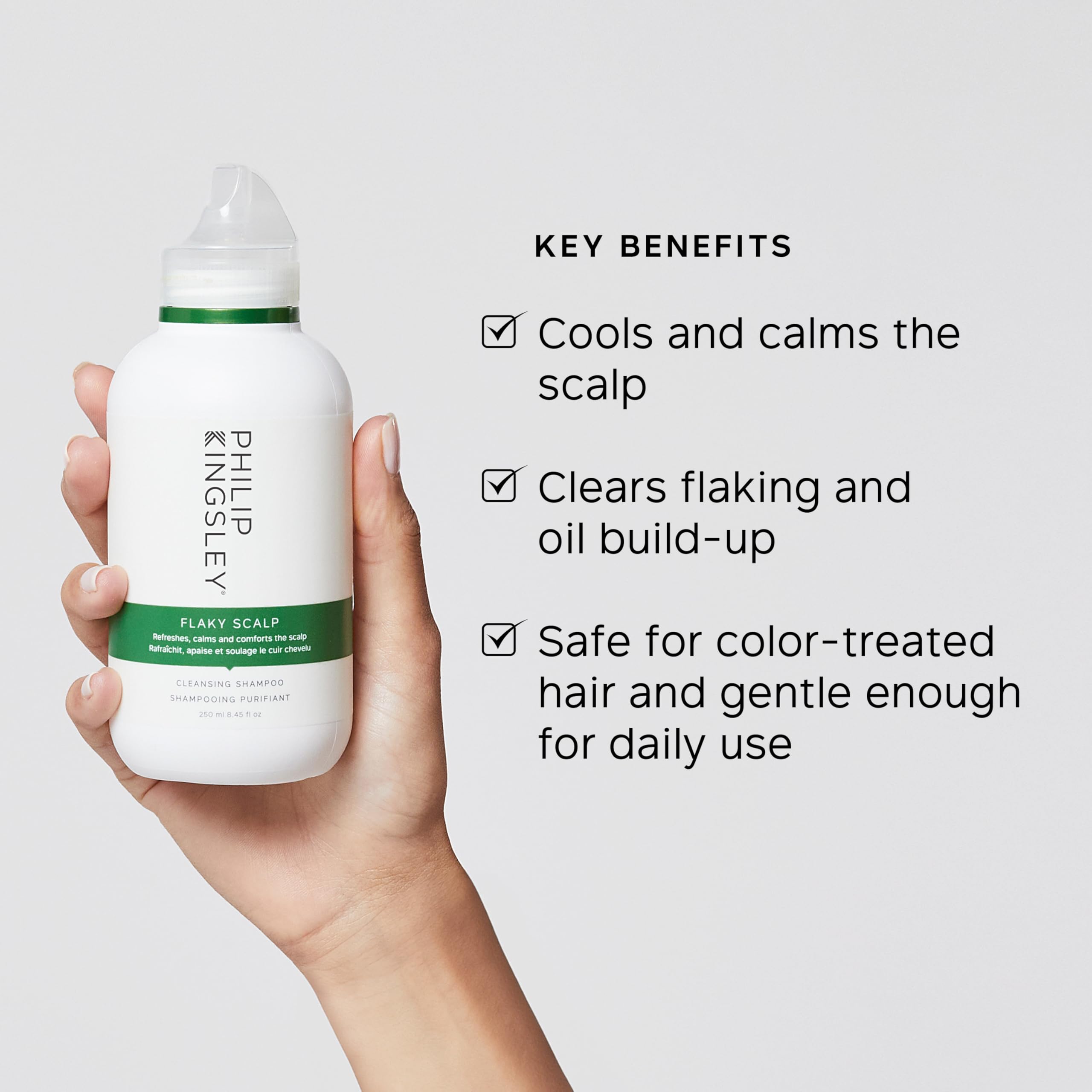 Philip Kingsley Flaky Scalp Shampoo bottle close-up highlights colour-safe formula.