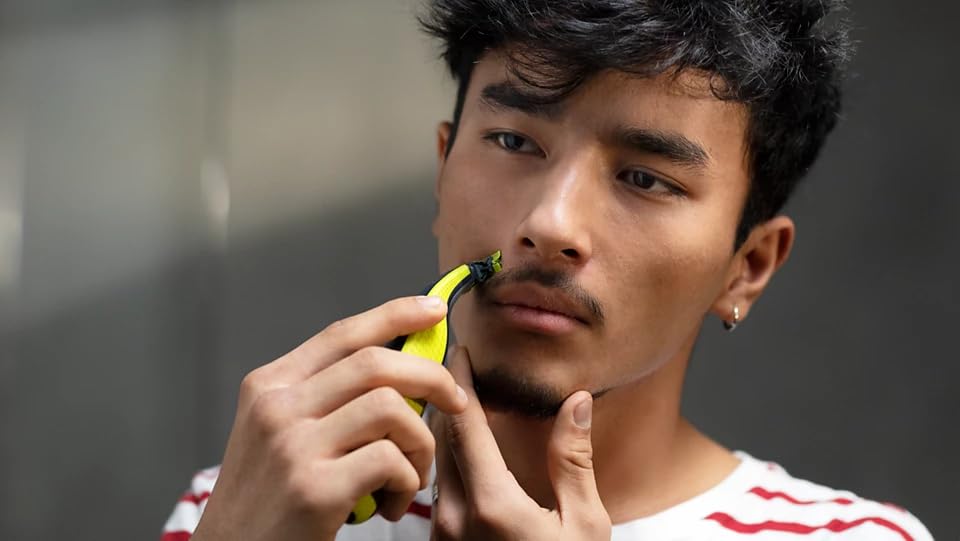 Philips OneBlade contour-following technology highlights effortless edge work.