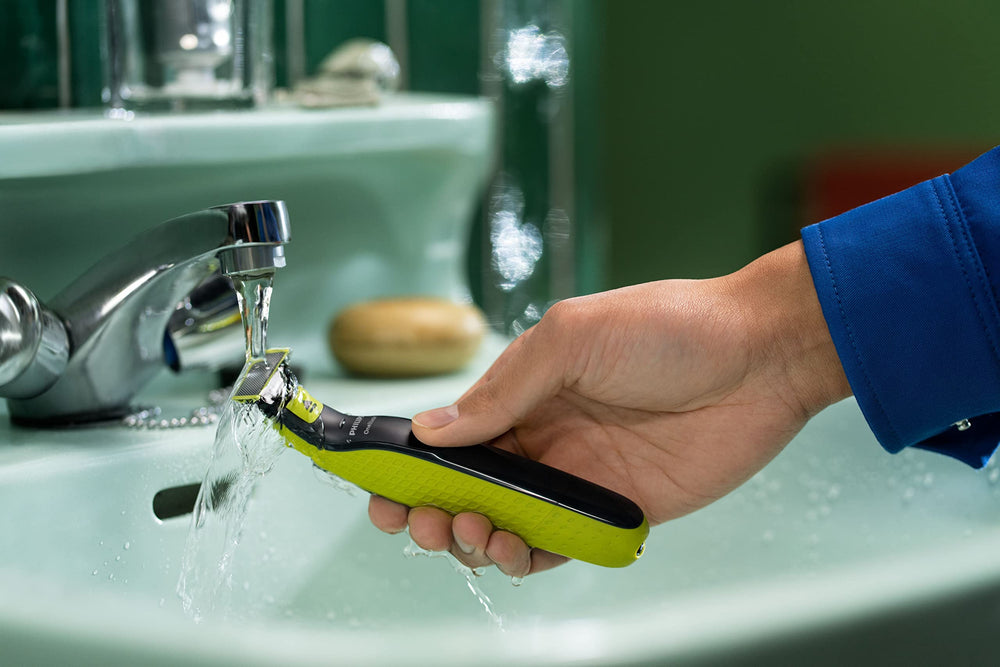 Philips OneBlade in-use staging demonstrates quick replacement during grooming routines.