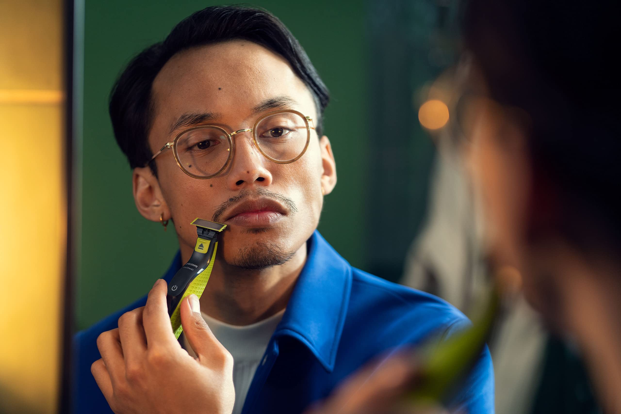 Philips OneBlade stainless-steel blade edge showcases durable trimming performance.