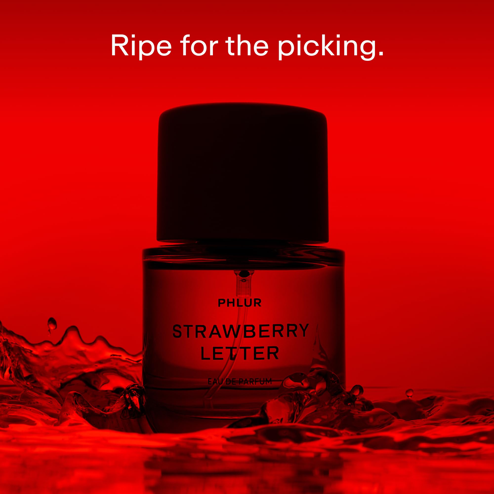 PHLUR Strawberry Letter bottle close-up highlighting the glass and fruity notes.