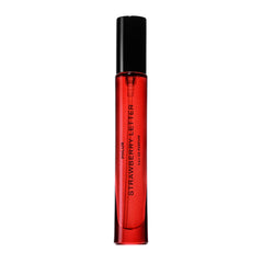 PHLUR Strawberry Letter bottle close-up, on-the-go luxury for daily wear.