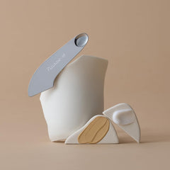 Piccasso 2-Way spatula flat foundation end for even coverage.