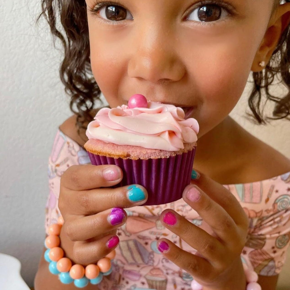 Piggy Paint kid-safe-use image shows joyful manicure time.