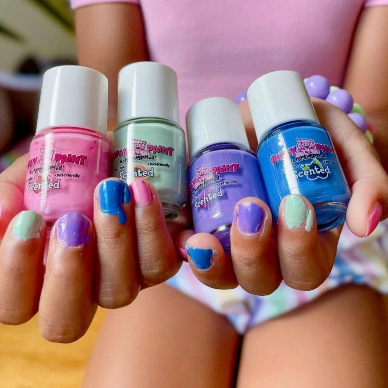 Piggy Paint Scented Fruit Fairy packaging highlights kid-safe ingredients and fragrance.