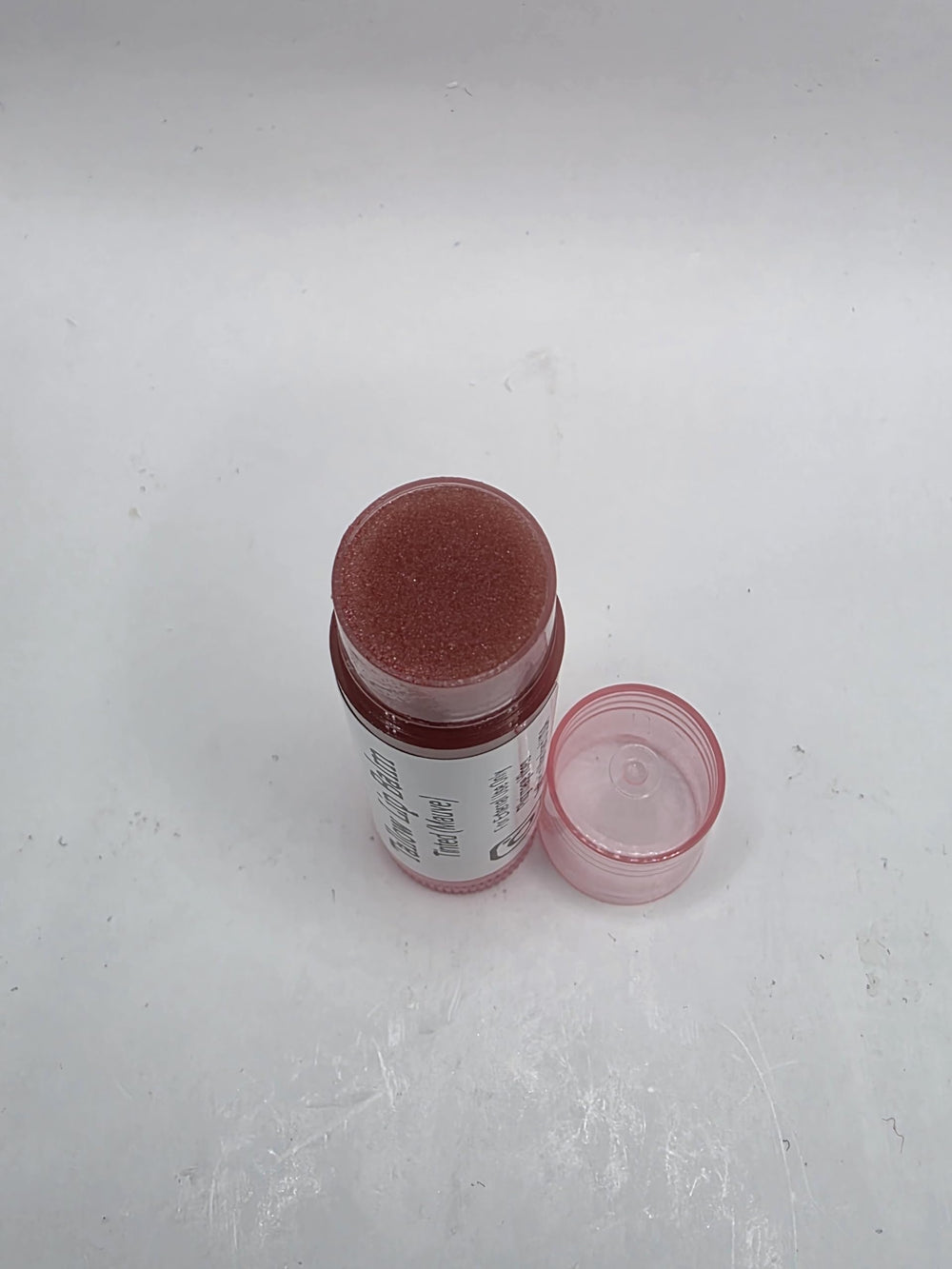 Pilgrimage Vibes lip balm being applied for smooth, lasting moisture.