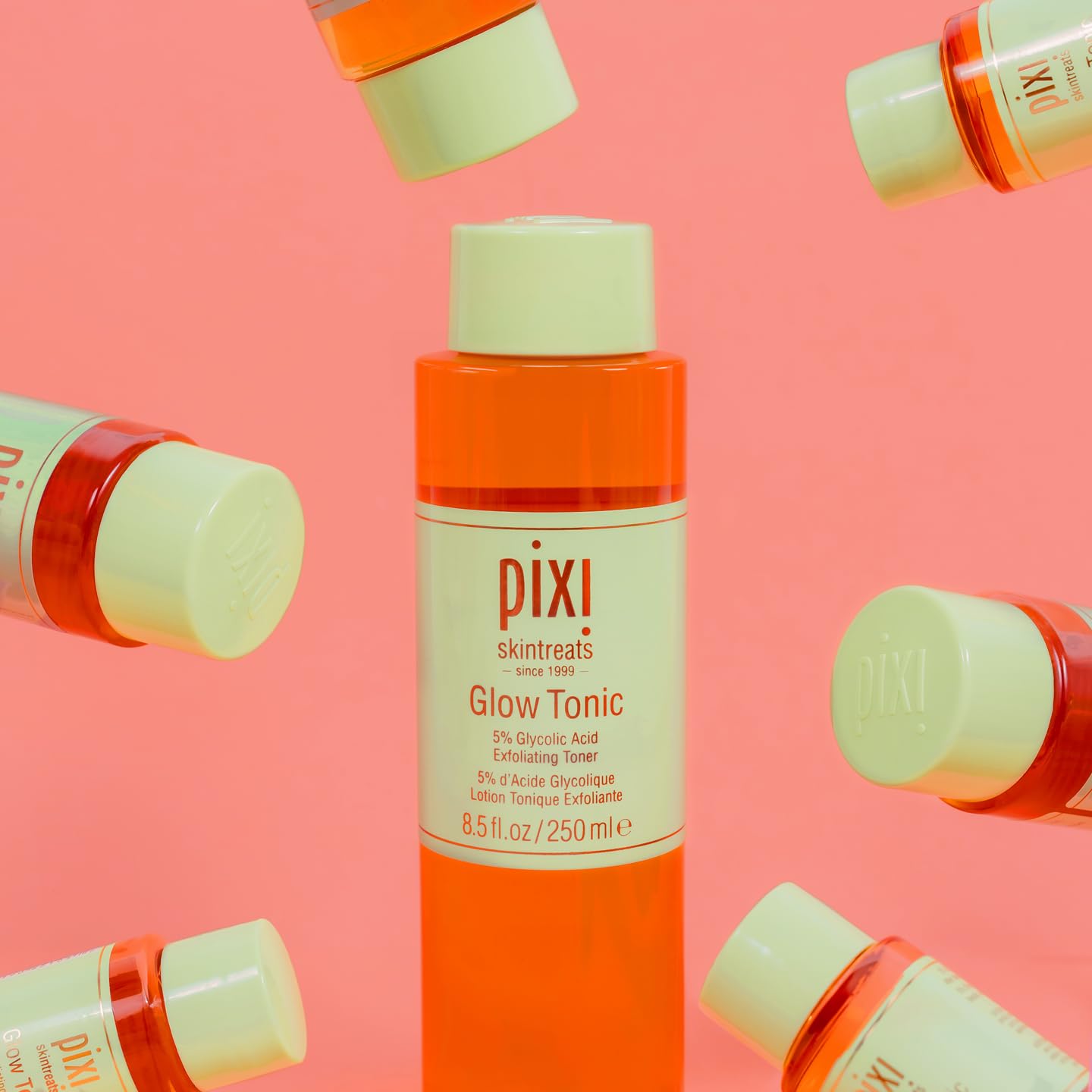 Pixi Glow Tonic amber bottle scene evokes premium, cruelty-free skincare.