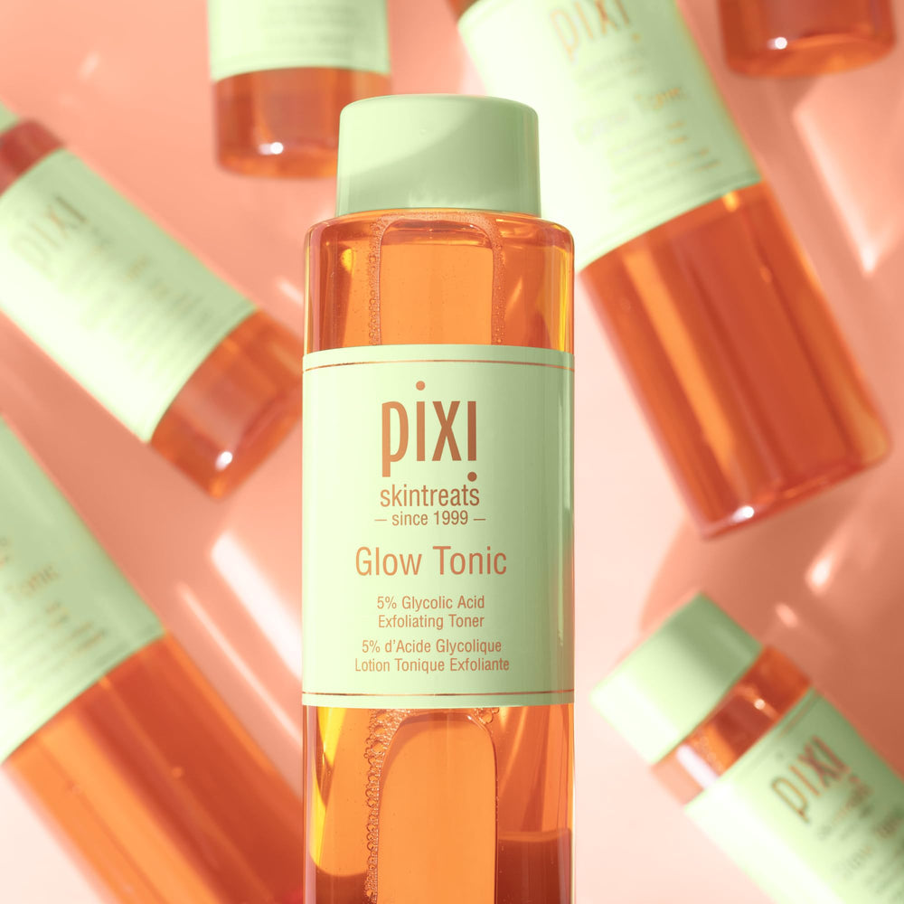 Pixi Glow Tonic glass bottle on vanity conveys daily brightening ritual.